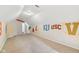Finished attic space with painted sports logos, offering potential for a recreation room at 6516 Shamel Dr, Indianapolis, IN 46278