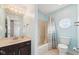 Bright bathroom with modern fixtures, including a marble vanity and octagonal window at 6516 Shamel Dr, Indianapolis, IN 46278