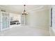 Bright dining room with French doors leading to a cozy living room at 6516 Shamel Dr, Indianapolis, IN 46278