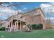 Back view of home shows the deck and brick architecture at 6516 Shamel Dr, Indianapolis, IN 46278