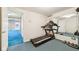 Bright gym features a treadmill and mirrored wall, perfect for home workouts at 6516 Shamel Dr, Indianapolis, IN 46278