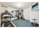 Spacious gym with ample equipment, mirrors, and a wall-mounted TV at 6516 Shamel Dr, Indianapolis, IN 46278