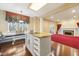 Spacious kitchen featuring an island with granite countertop, custom cabinets, and a charming breakfast nook with ample natural light at 6516 Shamel Dr, Indianapolis, IN 46278