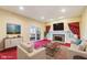 Living room with a fireplace, comfortable seating, and a view to the outdoor space at 6516 Shamel Dr, Indianapolis, IN 46278