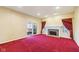 Bright living room with cozy fireplace and large windows, providing ample natural light and warmth at 6516 Shamel Dr, Indianapolis, IN 46278
