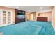 Entertainment space featuring custom wood TV cabinet and access to a wet bar at 6516 Shamel Dr, Indianapolis, IN 46278
