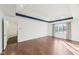 Spacious primary bedroom with hardwood floors and a tray ceiling, with natural light to create a calm, inviting ambiance at 6516 Shamel Dr, Indianapolis, IN 46278