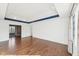 Unfurnished primary bedroom with hardwood floors and tray ceiling, ready for personalization at 6516 Shamel Dr, Indianapolis, IN 46278