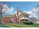 Two-story home with a brick exterior, screened porch, wood deck, stairs, and a well-maintained lawn at 6516 Shamel Dr, Indianapolis, IN 46278