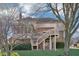 Exterior rear view featuring a deck, stairs, screened porch, brick, and siding at 6516 Shamel Dr, Indianapolis, IN 46278