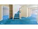 Inviting staircase with blue carpeting and wooden banister, connecting multiple levels of the home at 6516 Shamel Dr, Indianapolis, IN 46278