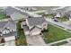 Aerial view of a two-story brick home with a two-car garage and a backyard patio at 7517 Heben Dr, Indianapolis, IN 46113