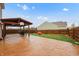 Spacious backyard with a covered patio area, stamped concrete, and grass at 7517 Heben Dr, Indianapolis, IN 46113