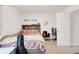 Cozy bedroom with a bed, desk, and decorative wall art at 7517 Heben Dr, Indianapolis, IN 46113