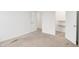 Empty bedroom featuring two closets, a doorway, and carpeted floors at 7517 Heben Dr, Indianapolis, IN 46113