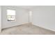 Bright, neutral bedroom with large window and tan carpet at 7517 Heben Dr, Indianapolis, IN 46113