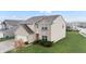 Charming two-story home featuring a brick facade, attached garage, and well-maintained lawn at 7517 Heben Dr, Indianapolis, IN 46113