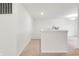 A hallway with carpeted floors, white walls and trim, and a light fixture on the ceiling at 7517 Heben Dr, Indianapolis, IN 46113