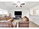 Spacious living room with hardwood floors, ceiling fan, and a cozy fireplace at 7517 Heben Dr, Indianapolis, IN 46113