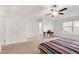 Bright main bedroom with a ceiling fan and carpeted floors at 7517 Heben Dr, Indianapolis, IN 46113