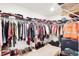Walk-in closet with lots of clothing and rack-and-shelf storage at 7517 Heben Dr, Indianapolis, IN 46113