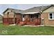 Cozy back deck with painted wood, awning, and well-maintained lawn provides inviting outdoor space at 791 W 500 S, Greenfield, IN 46140