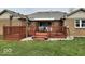 A backyard with a brick home featuring a lovely deck area, perfect for outdoor relaxation and entertainment at 791 W 500 S, Greenfield, IN 46140