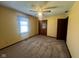 Bedroom featuring carpet floors, a window, ceiling fan, and closet space at 791 W 500 S, Greenfield, IN 46140