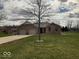 Charming single-story brick home with an attached two-car garage and a well-manicured front lawn at 791 W 500 S, Greenfield, IN 46140