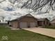This home features a wide driveway and a convenient two-car attached garage at 791 W 500 S, Greenfield, IN 46140