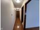 Long hallway featuring hardwood floors and neutral-toned walls under recessed lighting at 791 W 500 S, Greenfield, IN 46140