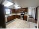 Updated kitchen with stainless steel appliances, tiled flooring, and adjacent dining area, perfect for modern living at 791 W 500 S, Greenfield, IN 46140