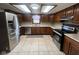 Bright kitchen featuring stainless steel appliances, ample counter space, and classic wood cabinetry at 791 W 500 S, Greenfield, IN 46140