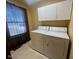 Convenient laundry room featuring a washer, dryer, upper cabinets, and a window at 791 W 500 S, Greenfield, IN 46140
