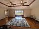 Bright living room features hardwood flooring, multiple seating arrangements and a large window at 791 W 500 S, Greenfield, IN 46140