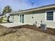 Inviting backyard featuring a concrete patio, new landscaping and a well maintained exterior at 8525 E 42Nd Pl, Indianapolis, IN 46226