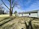 Expansive backyard with new fence, lush grass, and cozy patio, perfect for outdoor living at 8525 E 42Nd Pl, Indianapolis, IN 46226