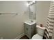 Bathroom showcasing a vanity with storage, a framed mirror, and a shower with a curtain at 8525 E 42Nd Pl, Indianapolis, IN 46226
