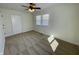 Neutral bedroom with plush carpet, ceiling fan, and natural light from dual windows at 8525 E 42Nd Pl, Indianapolis, IN 46226