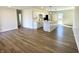 Open concept living area featuring hardwood floors, a modern kitchen with island, and natural light at 8525 E 42Nd Pl, Indianapolis, IN 46226