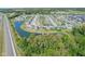 Aerial view of a neighborhood featuring ponds and green spaces near the highway at 9723 Violet Cir, Indianapolis, IN 46239