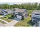 Aerial view of a home with a well-manicured lawn, landscaping, and backyard pond, showcasing curb appeal at 9723 Violet Cir, Indianapolis, IN 46239