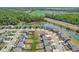 Aerial view of the neighborhood featuring ponds, green spaces and sidewalks at 9723 Violet Cir, Indianapolis, IN 46239