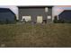 The large, grassy backyard with a stone patio offers ample space for outdoor entertaining and relaxation at 9723 Violet Cir, Indianapolis, IN 46239