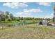 Beautiful backyard featuring a pond, patio area, and lush landscaping, creating a serene outdoor space at 9723 Violet Cir, Indianapolis, IN 46239