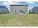 Spacious backyard with a patio area, perfect for outdoor entertaining, complemented by a grassy lawn at 9723 Violet Cir, Indianapolis, IN 46239