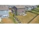 Backyard with patio, firepit, seating and a fenced yard next to a gray home at 9723 Violet Cir, Indianapolis, IN 46239