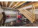 Unfinished basement with open ceiling and sealed flooring, as well as stairs leading up to first floor at 9723 Violet Cir, Indianapolis, IN 46239