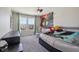 Well-lit bedroom featuring a unique mural and fan, with nice closet space, and comfortable carpeted floors at 9723 Violet Cir, Indianapolis, IN 46239