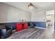 The dining room boasts hardwood floors, a crystal chandelier, and a stylish red bar with wine storage at 9723 Violet Cir, Indianapolis, IN 46239
